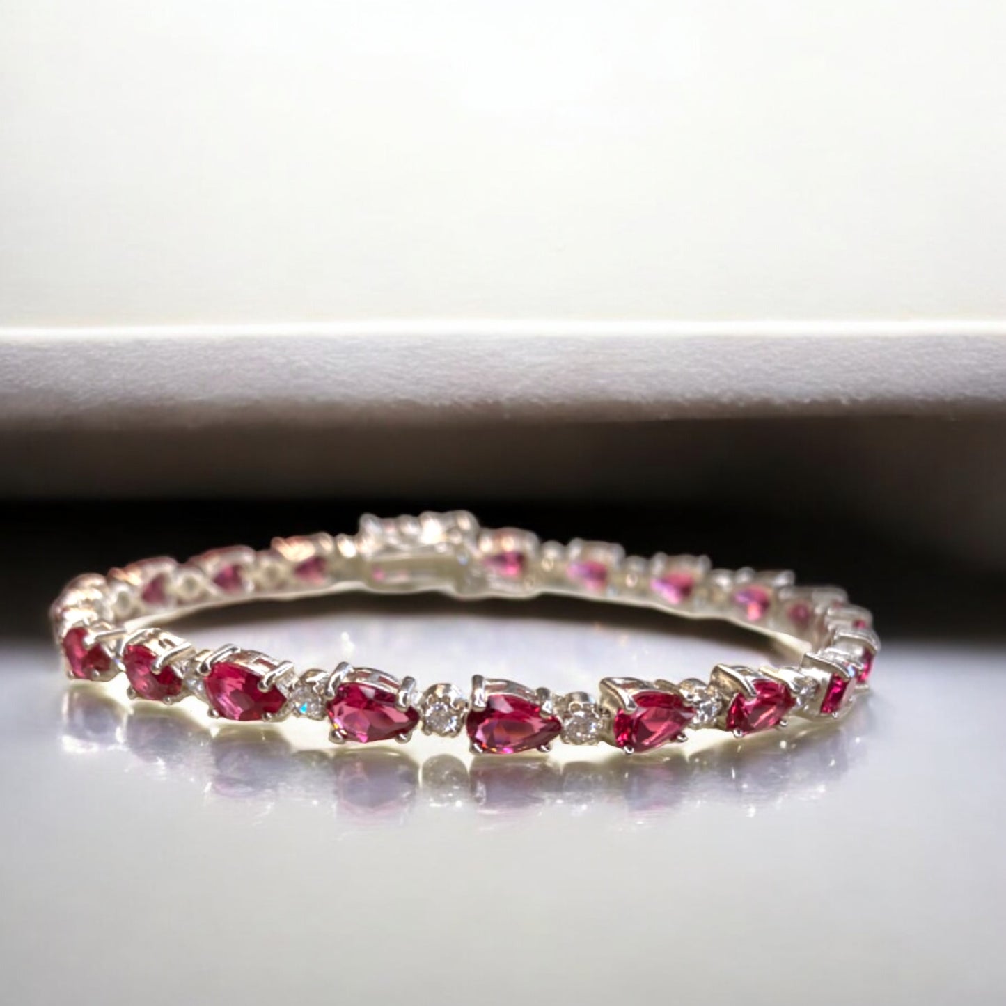 Sterling Silver Crystal Bracelet with Alternating Pear Shaped Deep Pink Crystals